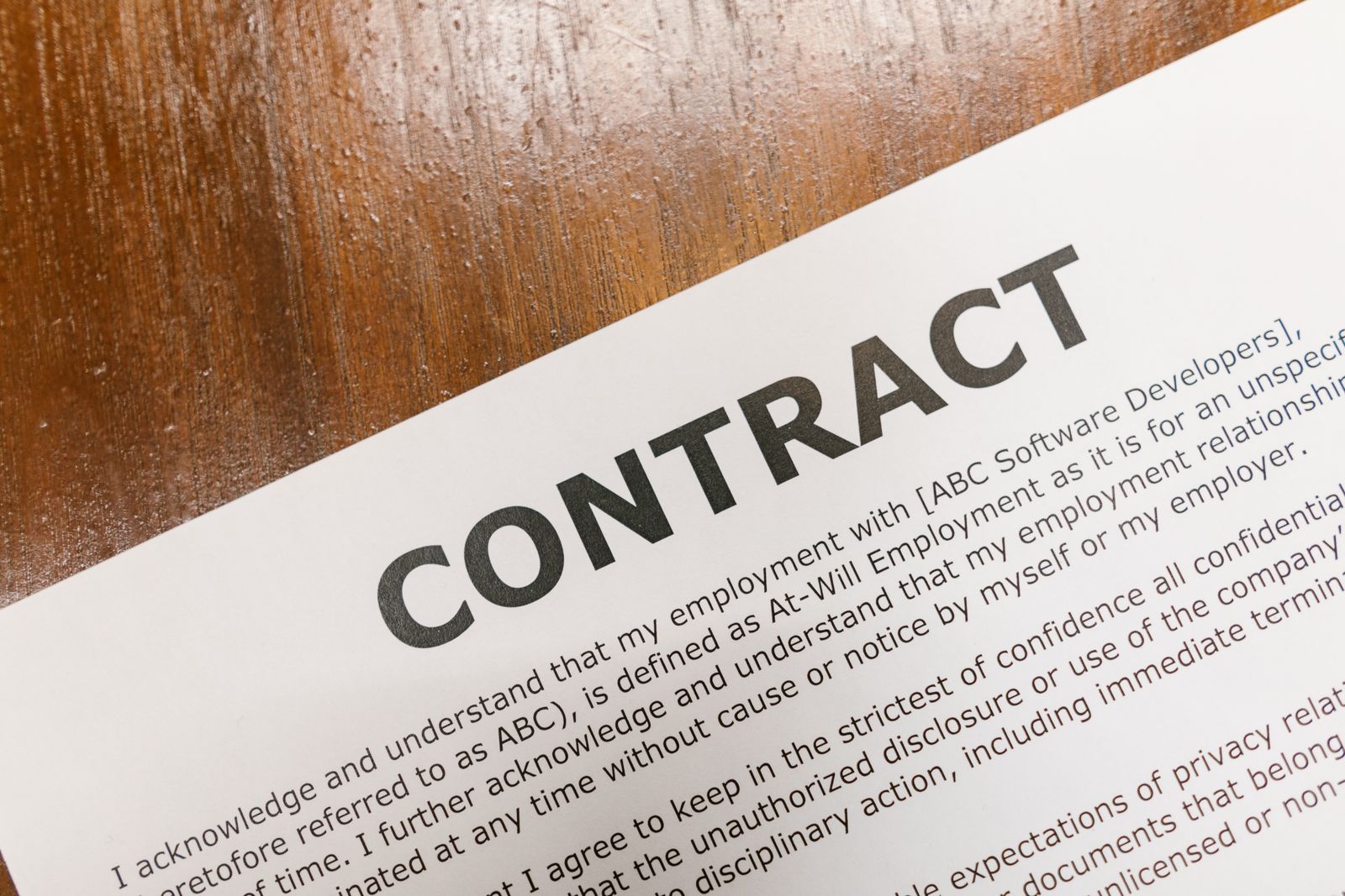 Printed operating agreement contract on a desk, the internal document that governs a Michigan LLC